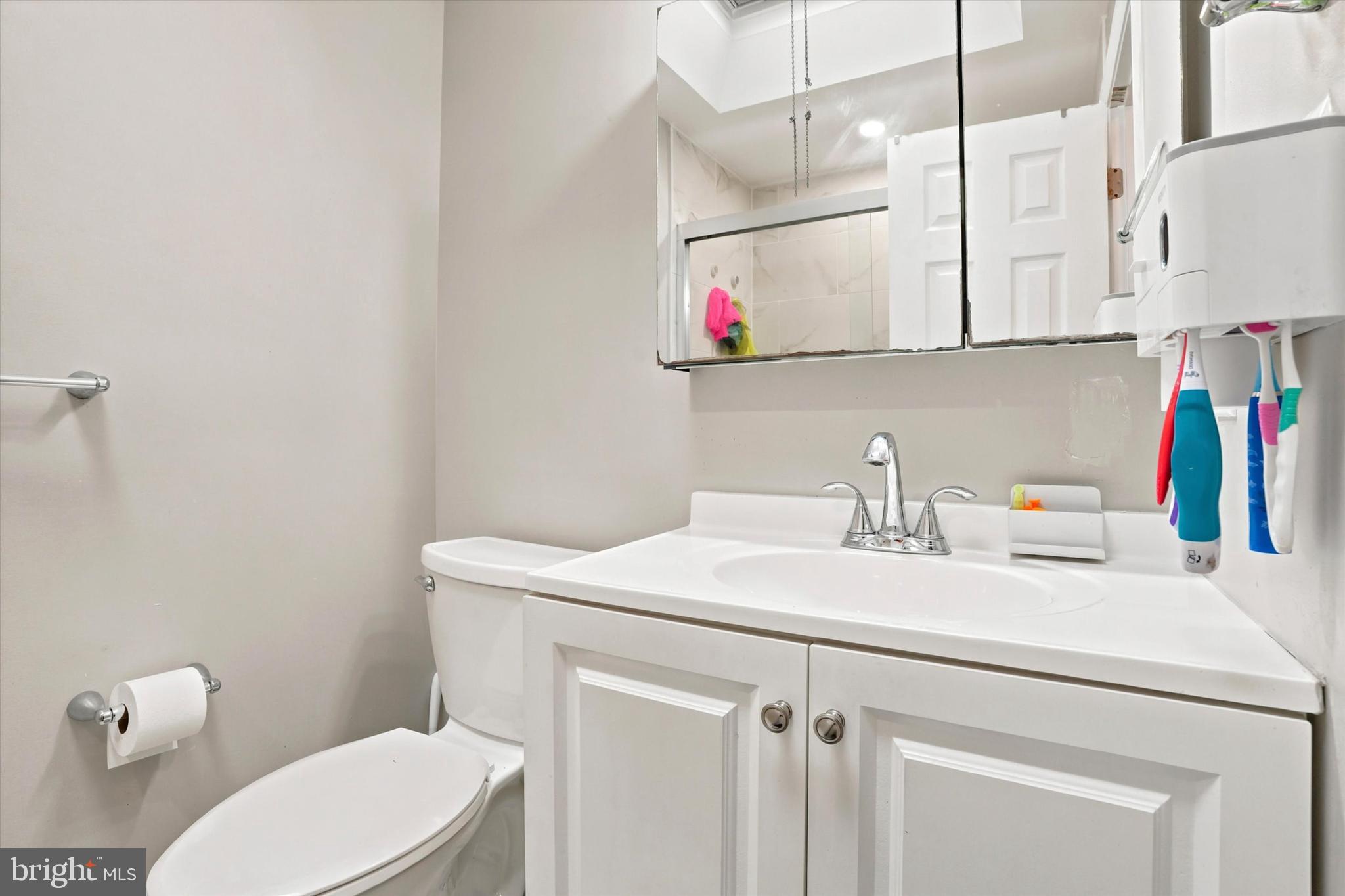 3435 Vinton Road Philadelphia, PA 19154 - Photo 18 of 25 a bathroom with a sink a toilet and a mirror