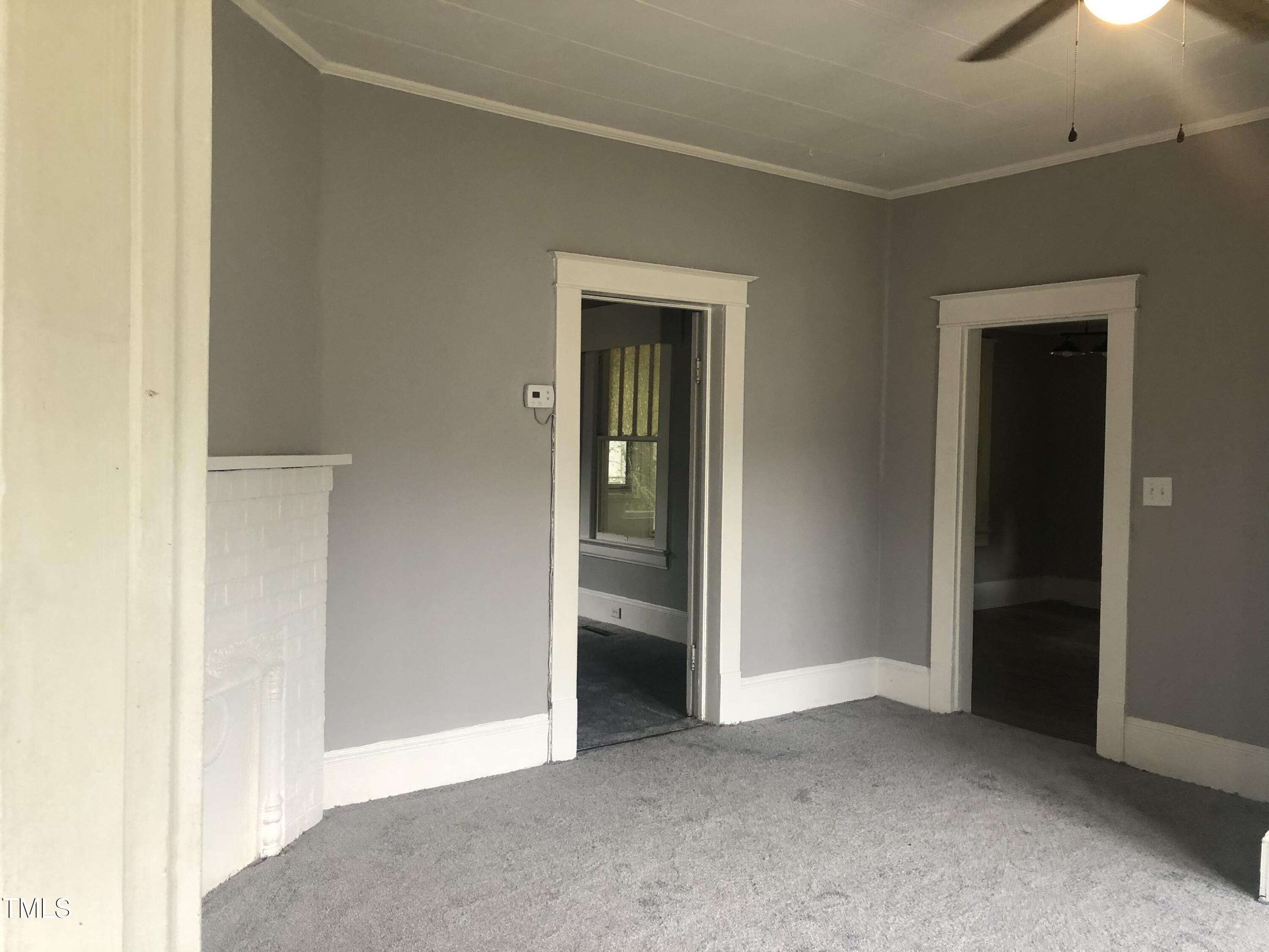 3124 Raleigh Road Henderson, NC 27537 - Photo 7 of 18 an empty room with closet and a bathroom