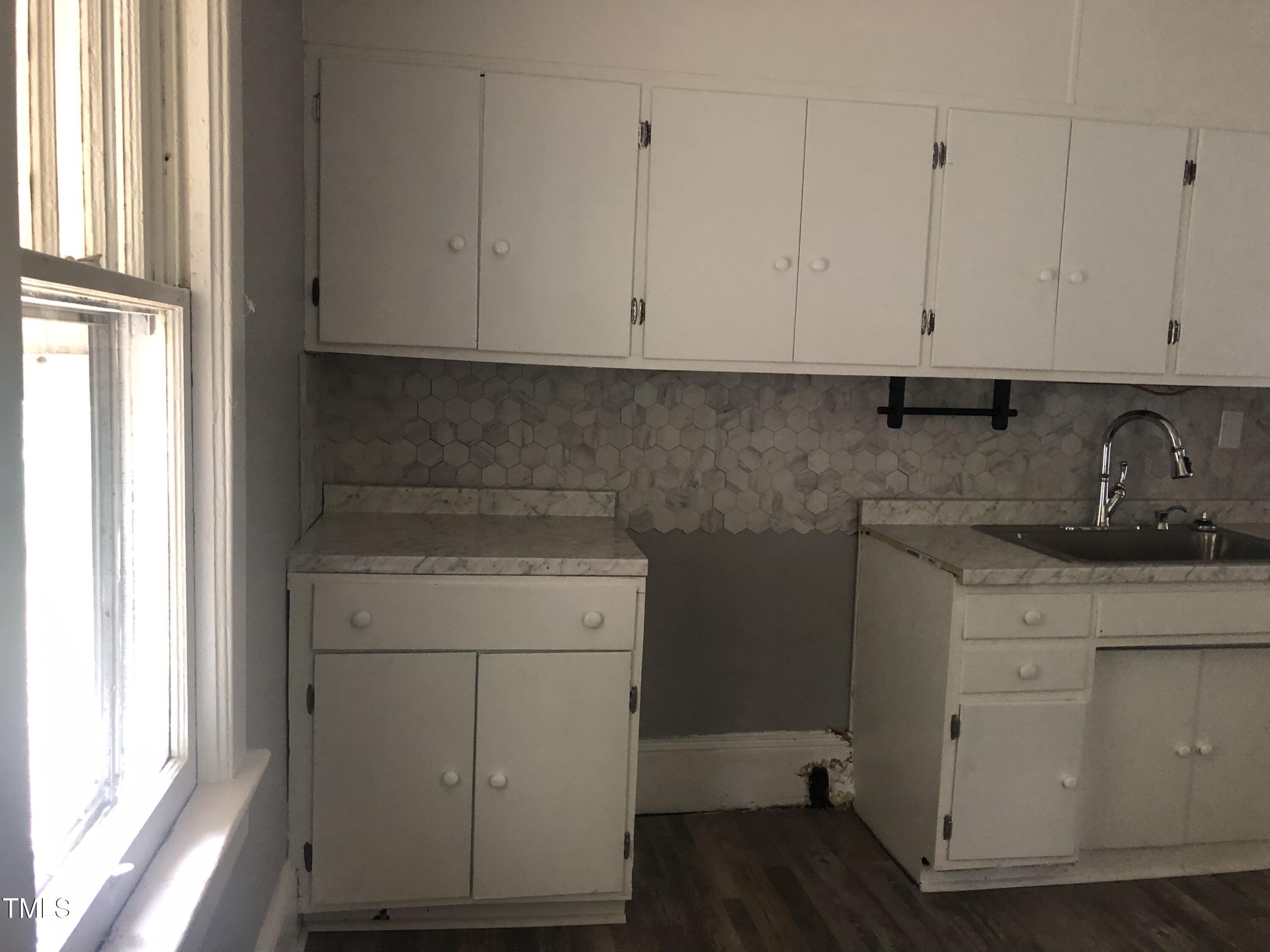 3124 Raleigh Road Henderson, NC 27537 - Photo 9 of 18 a room with storage and utility