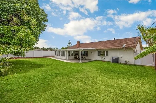 a view of a house with a garden
