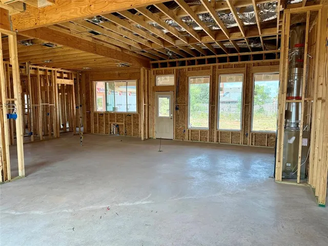 a view of an empty room with glass door