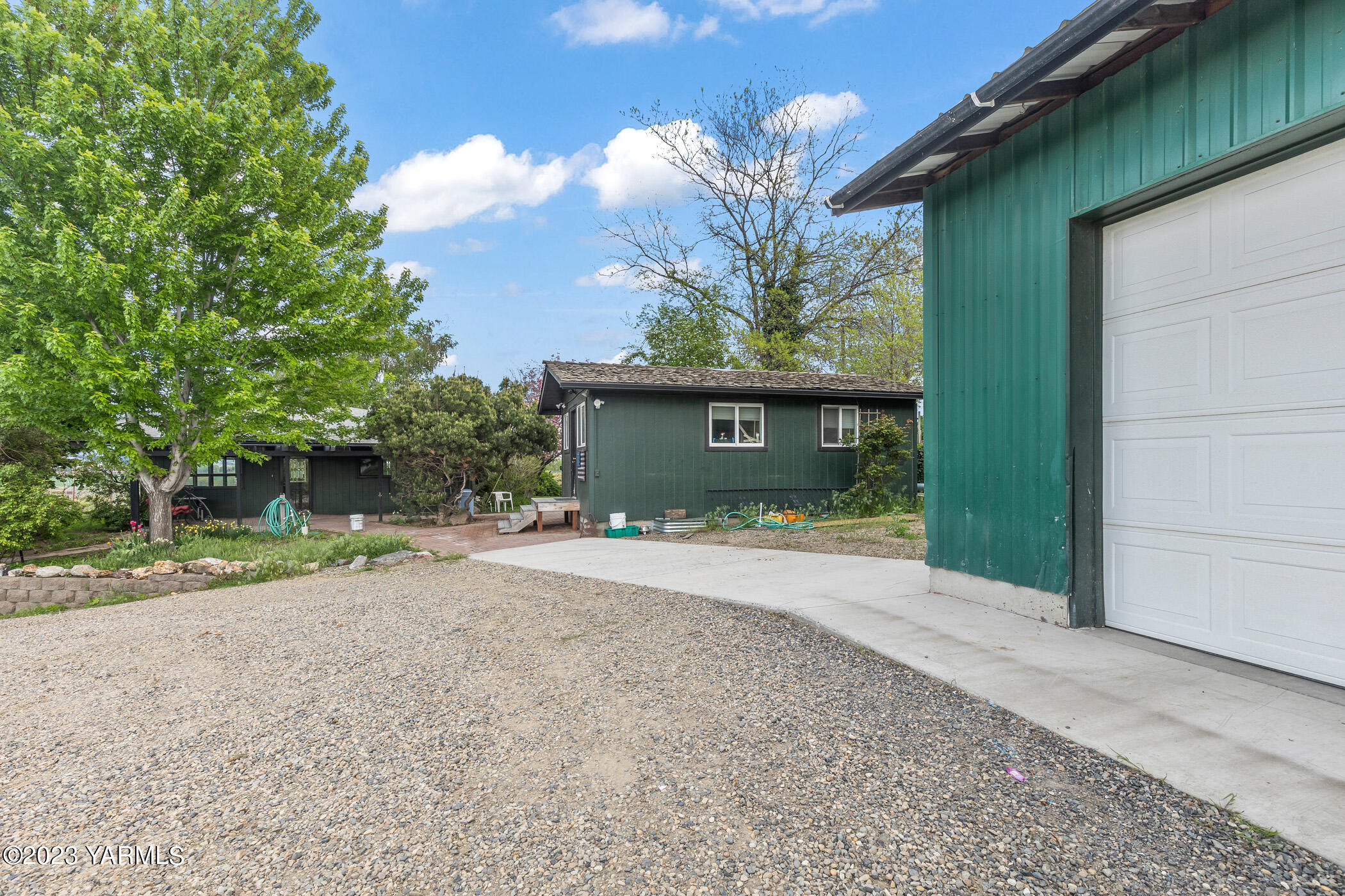 250 Bagley Road Granger, WA 98932 - Photo 17 of 23 a front view of a house with a yard and garage