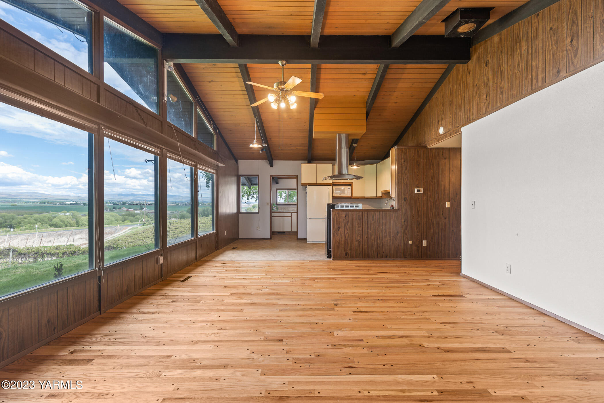 250 Bagley Road Granger, WA 98932 - Photo 4 of 23 a view of a room with a wooden floor