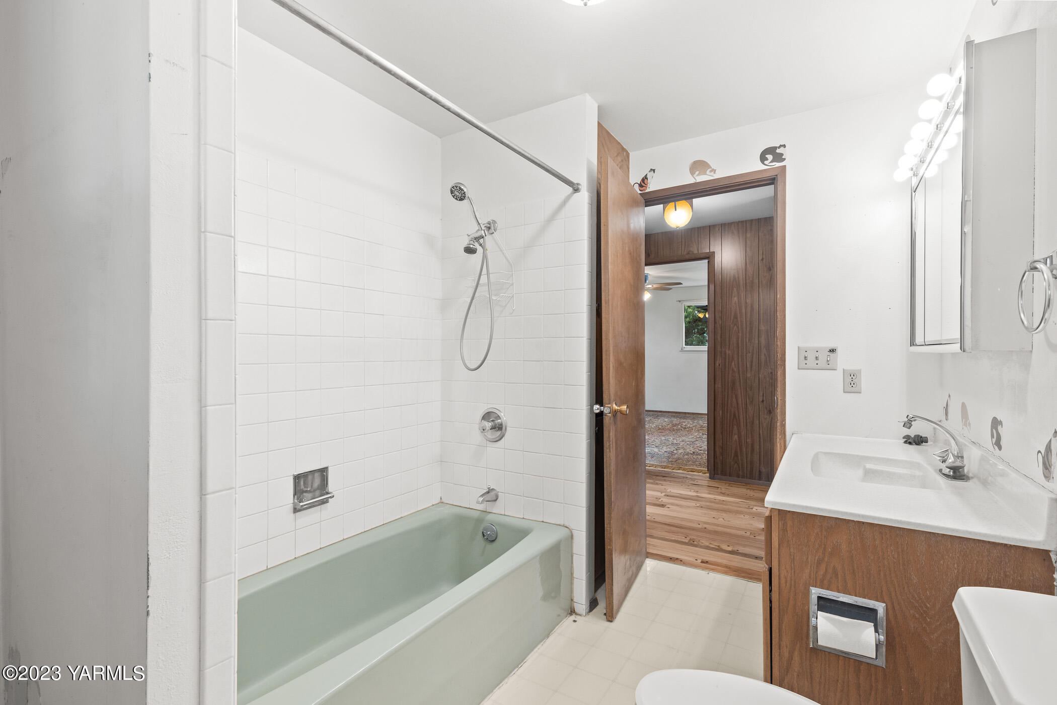 250 Bagley Road Granger, WA 98932 - Photo 10 of 23 a bathroom with a sink a toilet a mirror a bathtub and shower