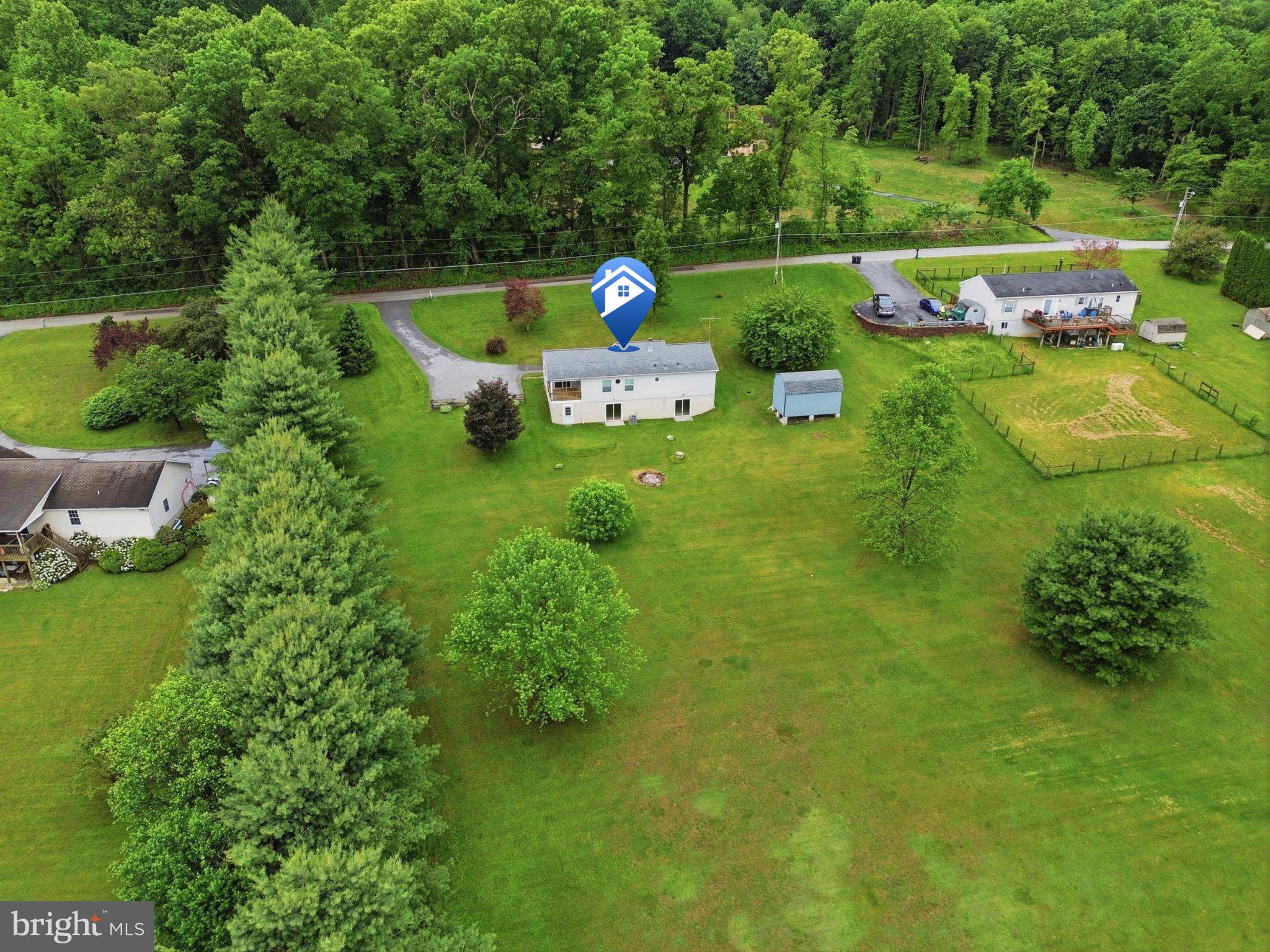 491 Garvine Mill Road Fawn Grove, PA 17321 - Photo 39 of 47 a backyard of a house with lots of green space and plants