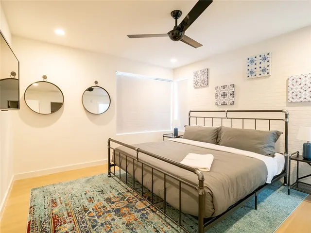 a bedroom with a bed and cabinets