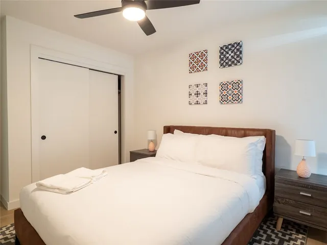 a bedroom with a bed and a dresser