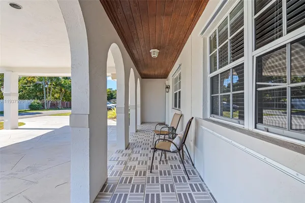 a kitchen with stainless steel appliances granite countertop a stove top oven a sink a counter top space and cabinets