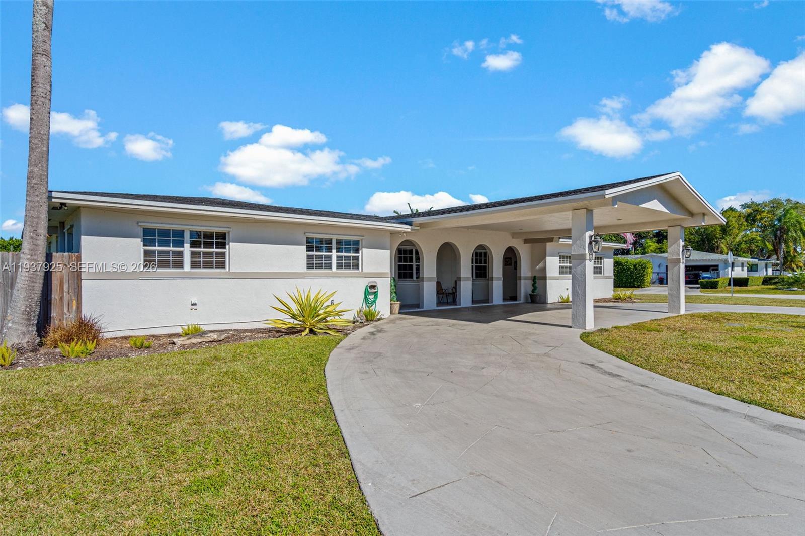 12805 Southwest 193rd Terrace Miami, FL 33177 - Photo 3 of 61 front view of a house with a yard
