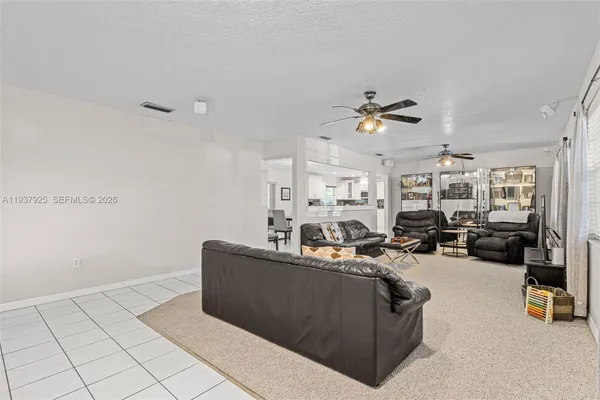 a kitchen with stainless steel appliances granite countertop a stove sink and microwave