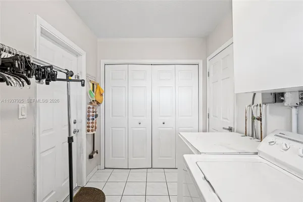 a bathroom with a granite countertop sink a toilet and bathtub