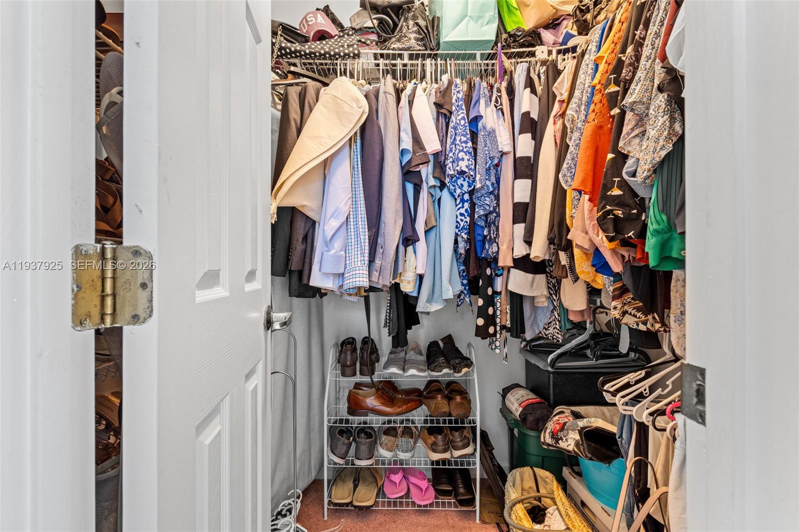 12805 Southwest 193rd Terrace Miami, FL 33177 - Photo 54 of 61 a view of walk in closet with clothes and shoes