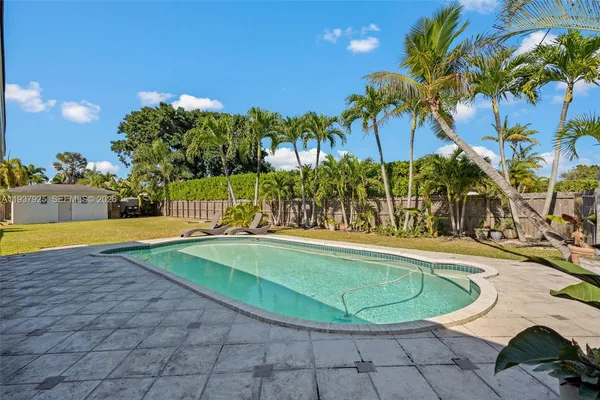 a view of a swimming pool with a patio