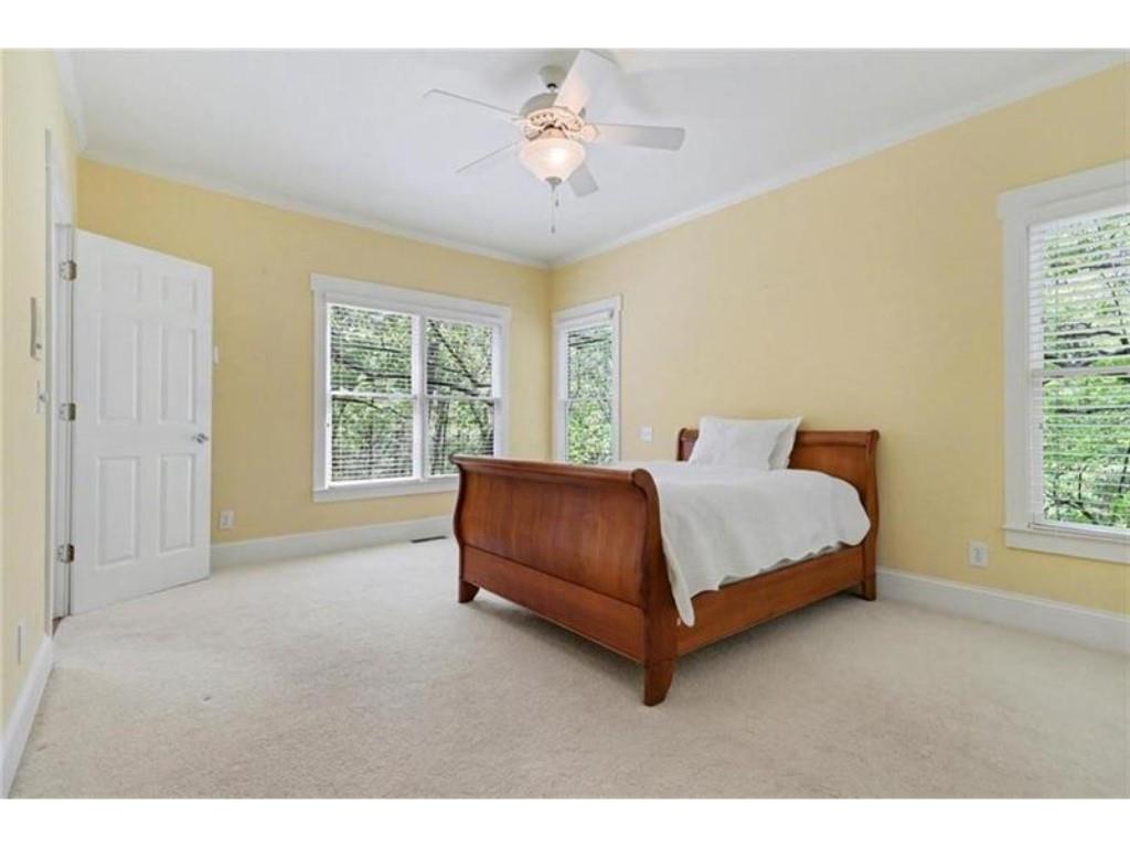 53 Pinto Place Jasper, GA 30143 - Photo 9 of 62 a spacious bedroom with a bed and a chandelier