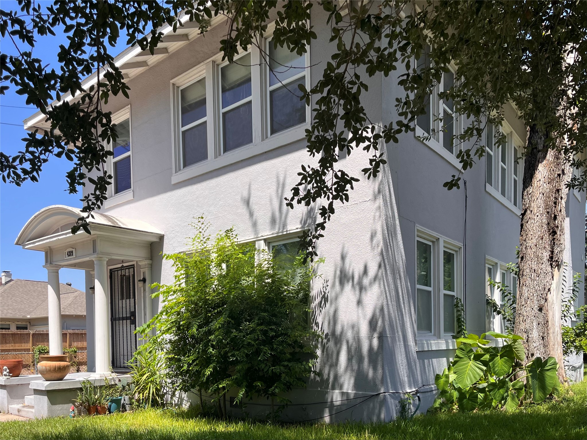 front view of a house with a garden