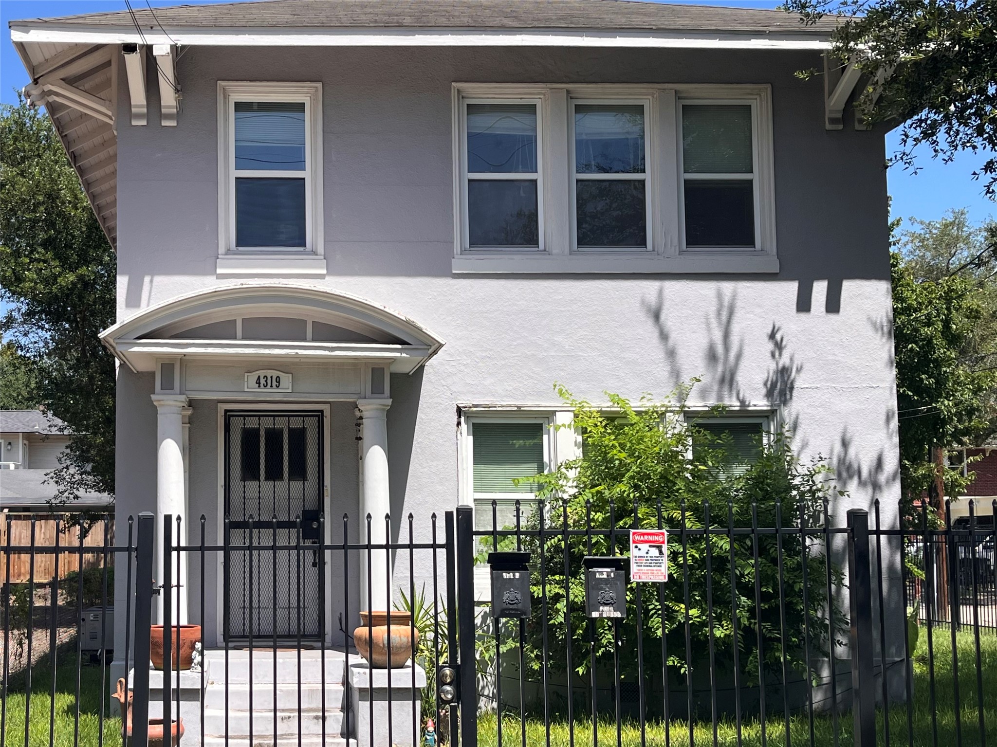 4319 Roseland Street Houston, TX 77006 - Photo 2 of 6 a front view of a house with a yard