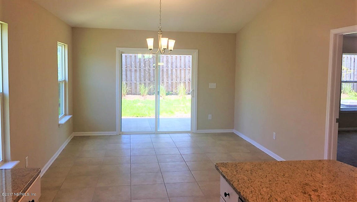 313 Deer Crossing Road St. Augustine, FL 32086 - Photo 6 of 11 a view of an empty room with a window