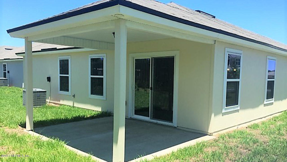 313 Deer Crossing Road St. Augustine, FL 32086 - Photo 7 of 11 a front view of a house with a yard