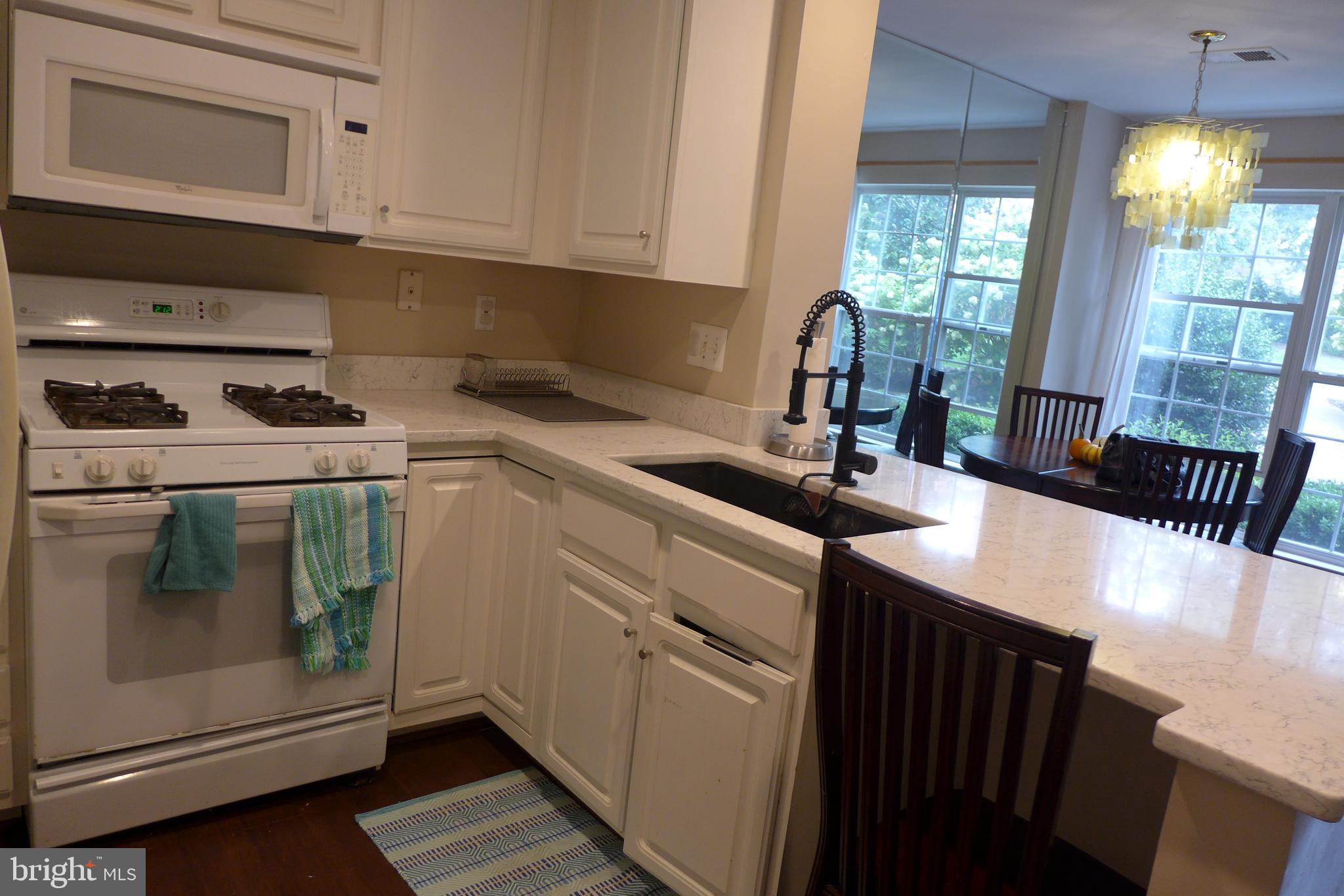 11872 Breton Court, Unit 12A Reston, VA 20191 - Photo 7 of 30 Kitchen overlooking at dining area