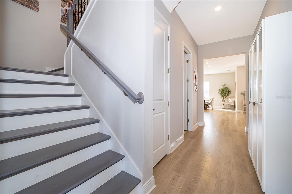 16033 Volterra Point Bella Collina, FL 34756 - Photo 11 of 54 a view of a hallway with wooden floor and staircase