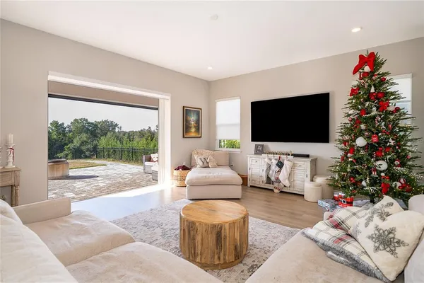a bedroom with furniture and a window