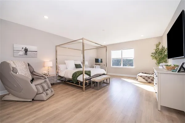 a bathroom with a shower and a glass door