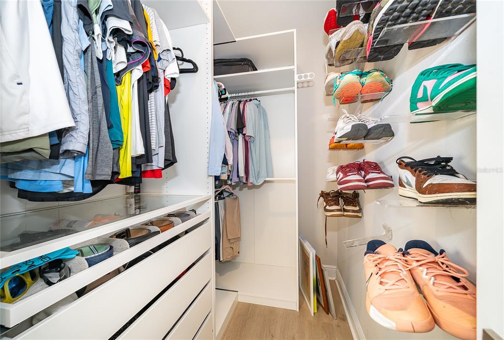 16033 Volterra Point Bella Collina, FL 34756 - Photo 29 of 54 a view of walk in closet with clothes and shoes