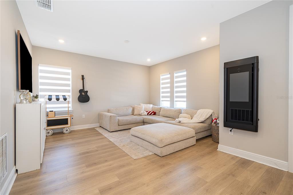 16033 Volterra Point Bella Collina, FL 34756 - Photo 30 of 54 a bedroom with furniture and a window