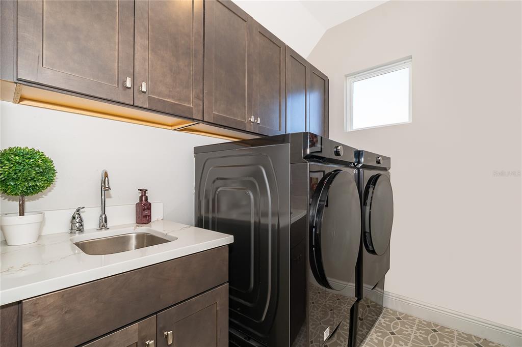 16033 Volterra Point Bella Collina, FL 34756 - Photo 32 of 54 a kitchen with stainless steel appliances a refrigerator and a sink