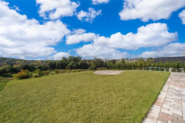 an aerial view of a house with garden space and street view