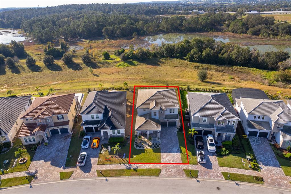 16033 Volterra Point Bella Collina, FL 34756 - Photo 4 of 54 a view of multiple houses with a lake