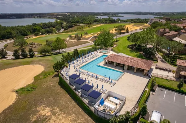 an aerial view of a house with a swimming pool