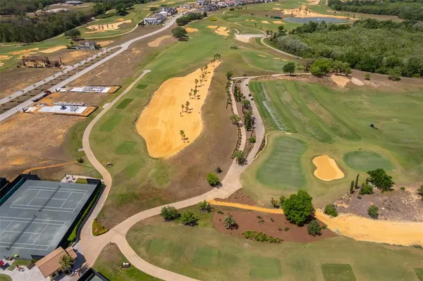 an aerial view of residential house with outdoor space and swimming pool