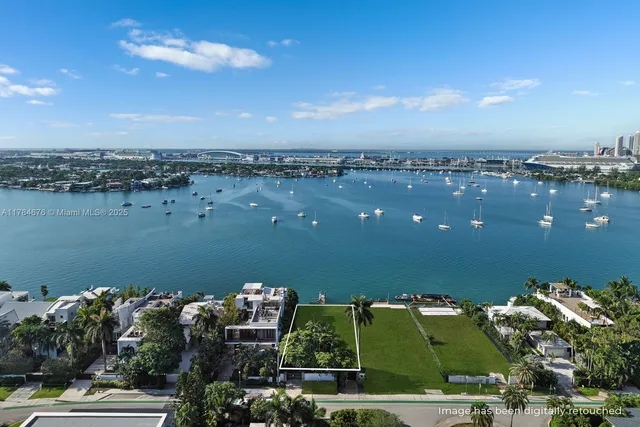 a view of a lake with a house in the background