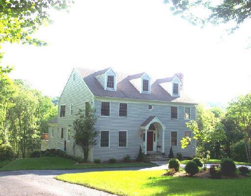 15 Titicus Court Ridgefield, CT 06877 - Photo 1 of 1 a front view of a house with garden