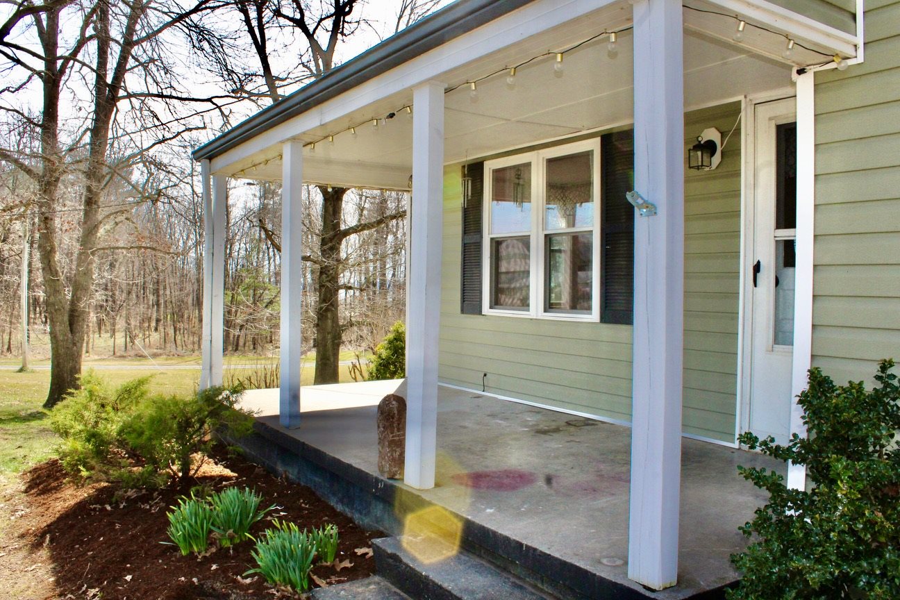 8862 Community Center Road Bridgewater, VA 22812 - Photo 11 of 29 a view of a house with a large windows and yard