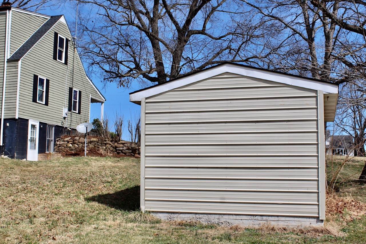 8862 Community Center Road Bridgewater, VA 22812 - Photo 15 of 29 a view of a house with a yard and tree in the background