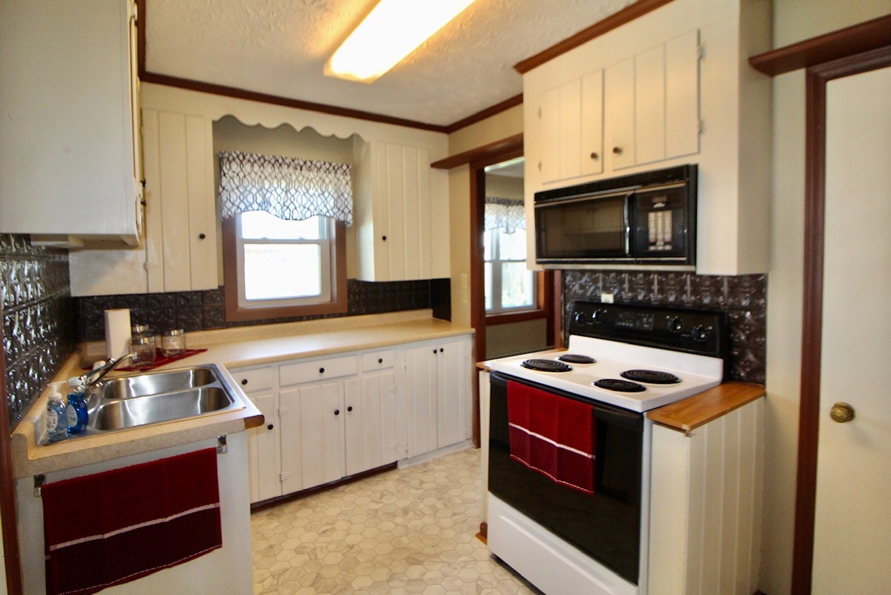 8862 Community Center Road Bridgewater, VA 22812 - Photo 17 of 29 a kitchen with granite countertop cabinets stainless steel appliances and a counter space