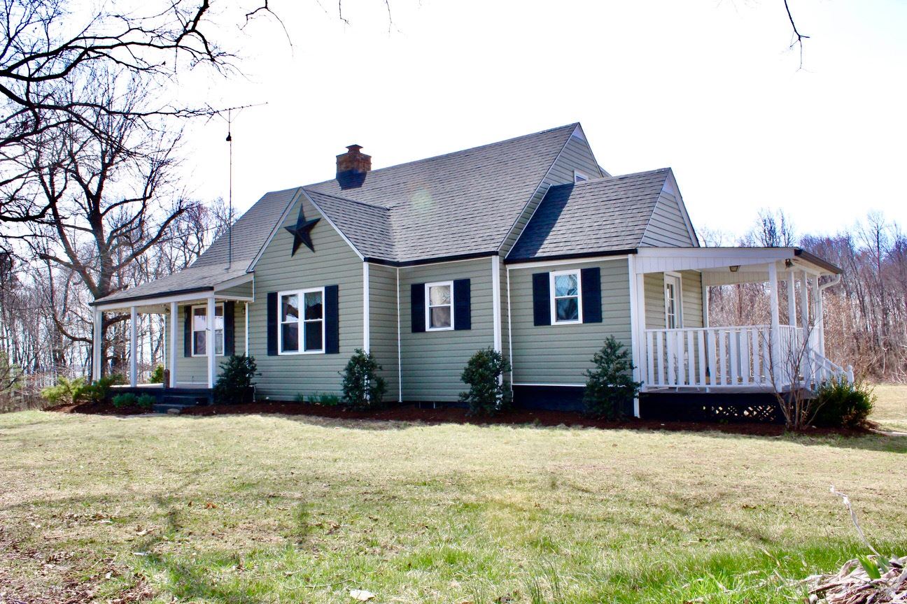 8862 Community Center Road Bridgewater, VA 22812 - Photo 2 of 29 a front view of a house with a yard