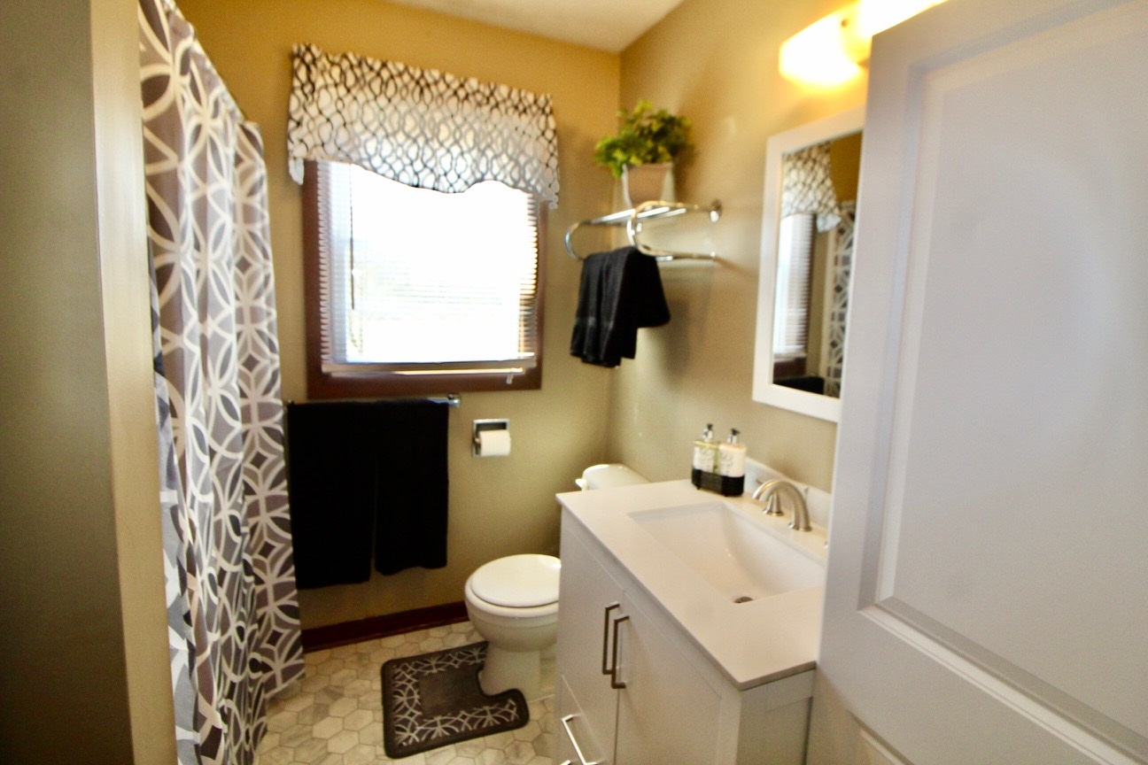 8862 Community Center Road Bridgewater, VA 22812 - Photo 21 of 29 a bathroom with a sink toilet and mirror