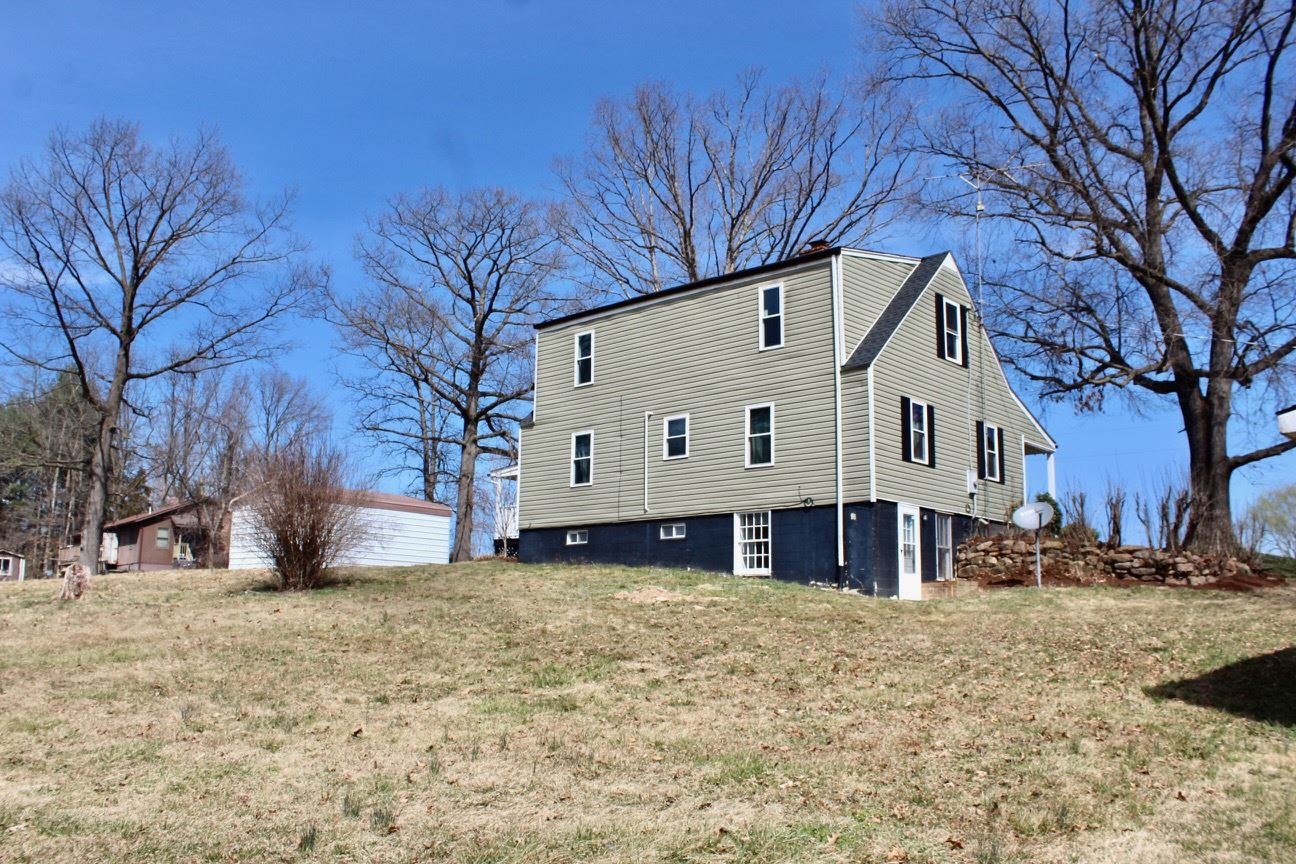 8862 Community Center Road Bridgewater, VA 22812 - Photo 6 of 29 a view of a white house with a snow