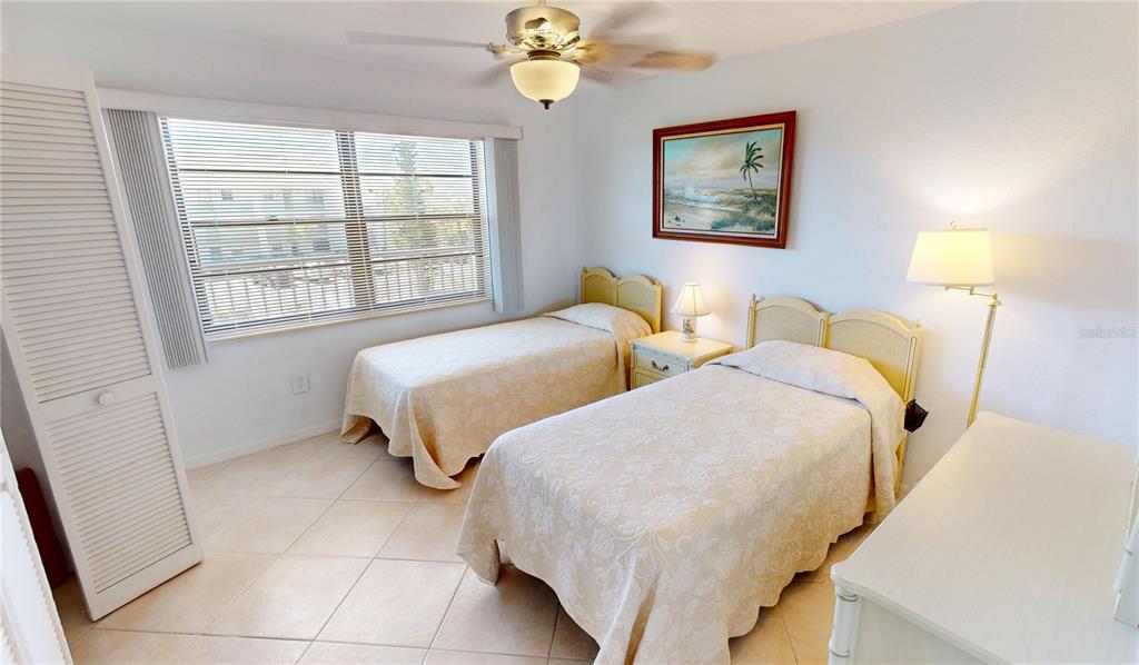 175 Kings Highway, Unit 736 Punta Gorda, FL 33983 - Photo 18 of 29 a bedroom with two beds and a window