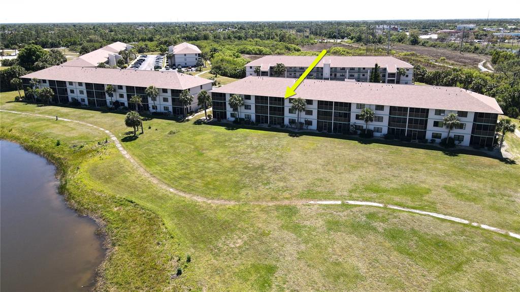 175 Kings Highway, Unit 736 Punta Gorda, FL 33983 - Photo 25 of 29 a view of a swimming pool and deck