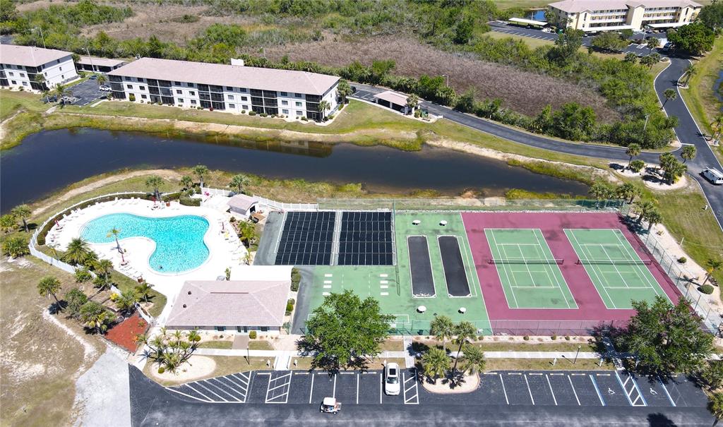 175 Kings Highway, Unit 736 Punta Gorda, FL 33983 - Photo 27 of 29 an aerial view of a house with swimming pool patio and lake view