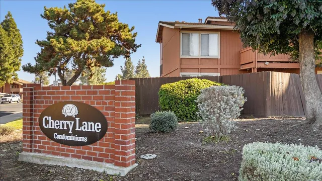 a sign that is sitting on the wooden wall