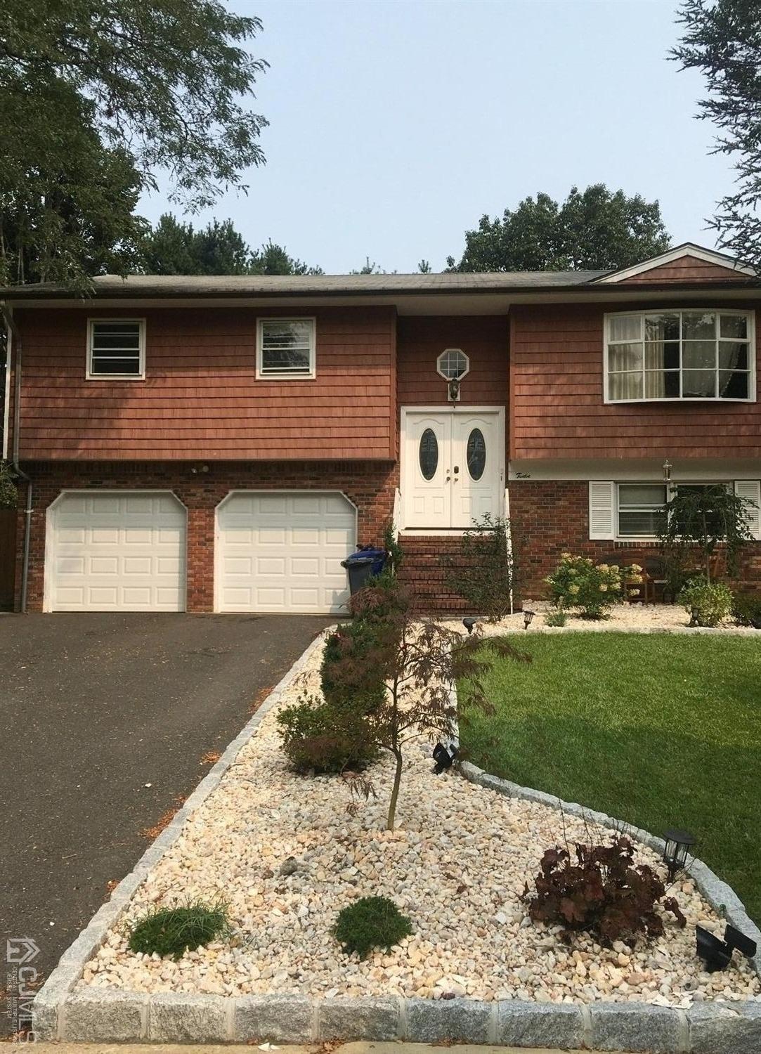 12 Crest Road East Brunswick, NJ 08816 - Photo 2 of 30 a front view of a house with a yard