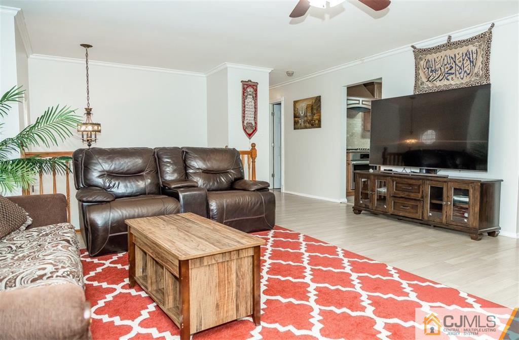 12 Crest Road East Brunswick, NJ 08816 - Photo 11 of 30 a living room with furniture and a flat screen tv