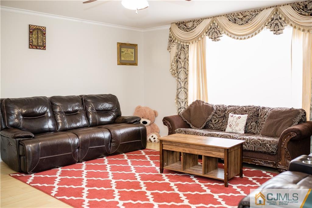 12 Crest Road East Brunswick, NJ 08816 - Photo 12 of 30 a living room with furniture and a rug