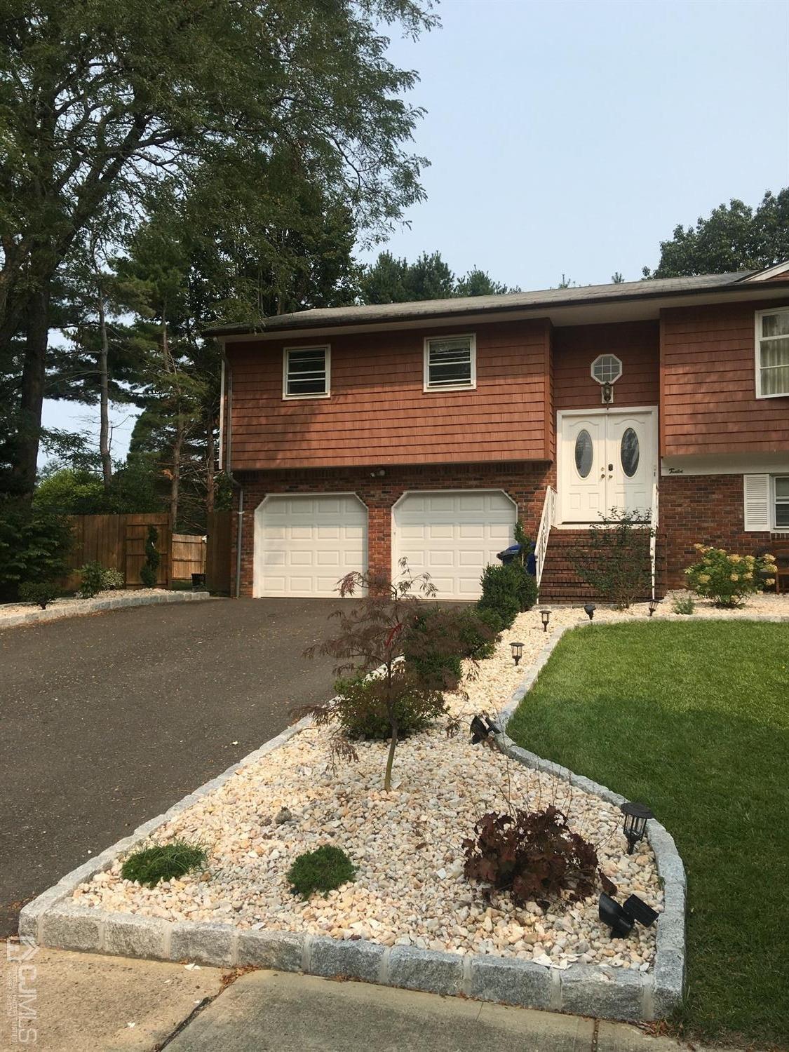 12 Crest Road East Brunswick, NJ 08816 - Photo 3 of 30 a front view of a house with a yard