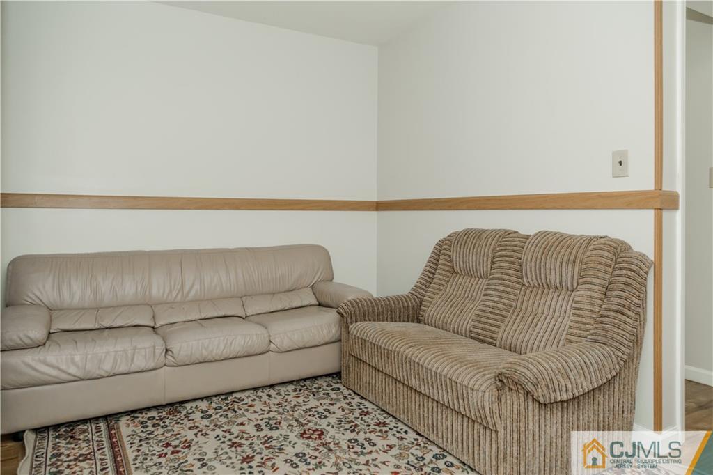 12 Crest Road East Brunswick, NJ 08816 - Photo 21 of 30 a living room with a couch and a rug